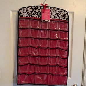 Organizer with 66 clear pockets.  Can hang in closet or in wall.   New.